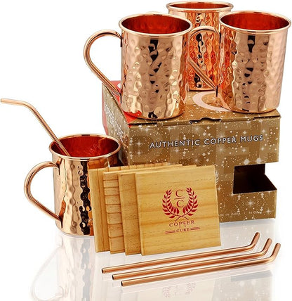Gift Set Pure Copper Hammered Mugs with Copper Straws & Wooden Coasters Set of 4 - PREMIUM QUALITY -16 Oz Copper Mug - 100% Handcrafted - A Gift Pack for your loved Ones.